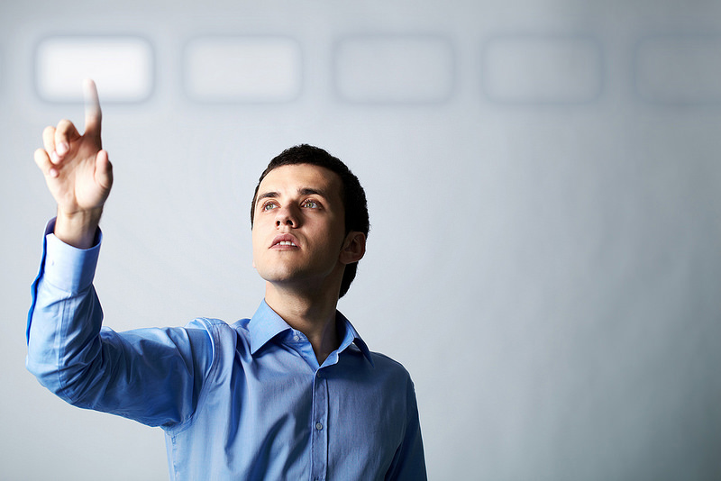 man pointing at button