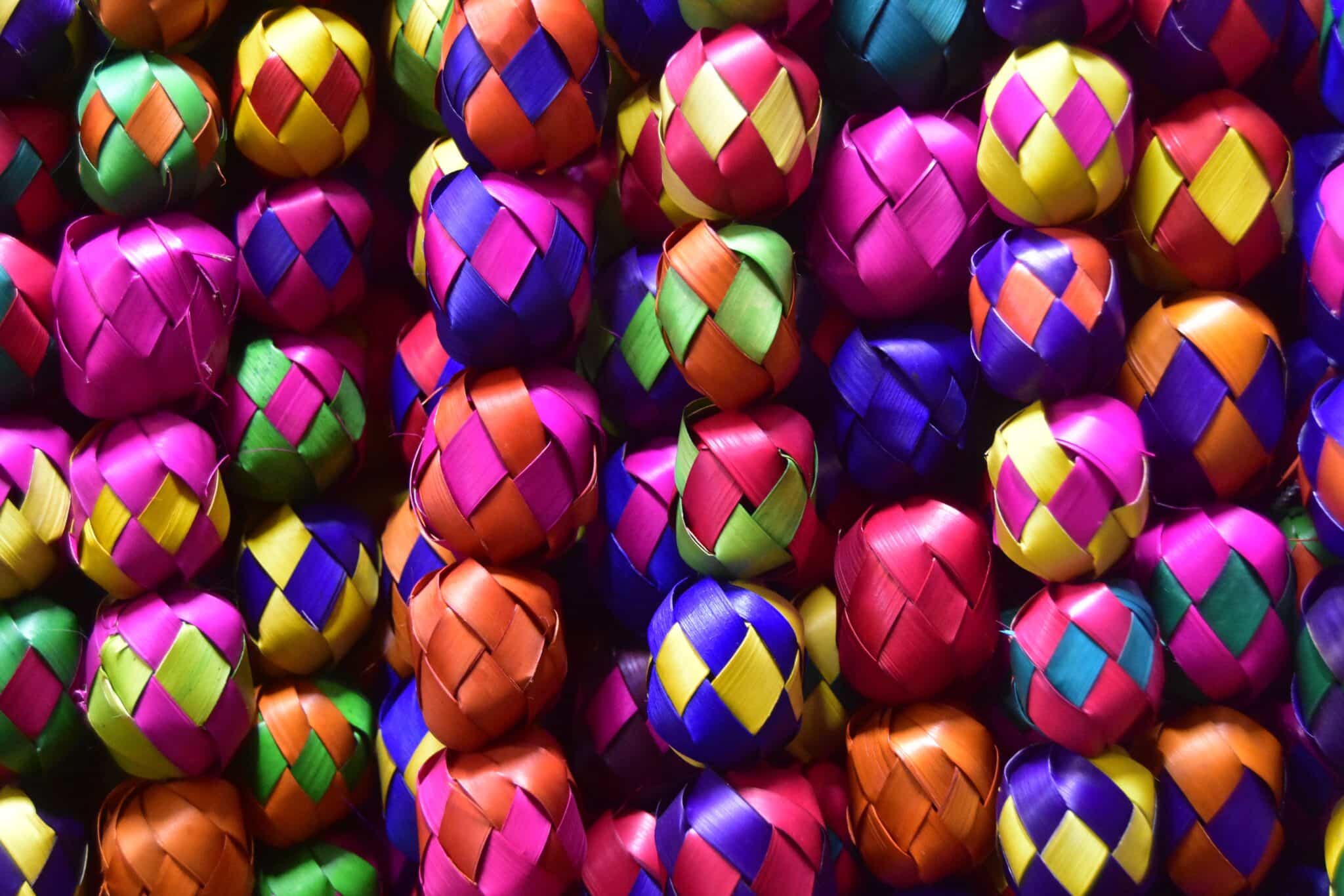 A collection of hispanic celebratory ornaments made of paper.
